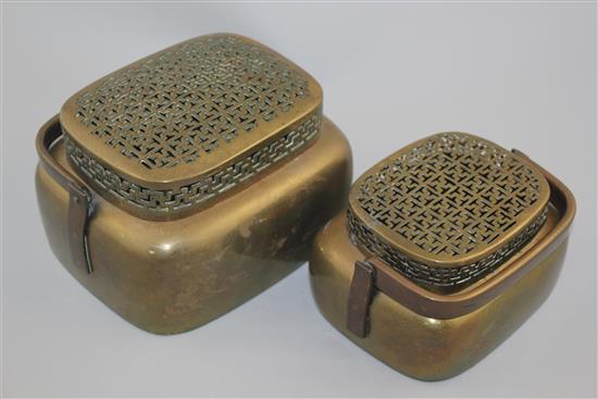 Two Chinese bronze hand warmers, 18th / 19th century, 17cm and 20.5cm, repair to smaller cover